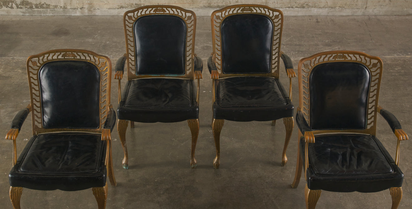 SET OF FOUR BRONZE ARM CHAIRS WITH PATENT LEATHER